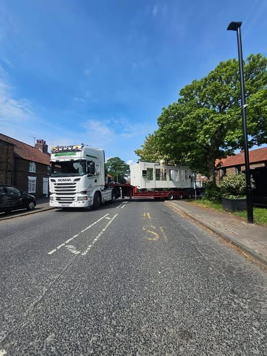 ILEX Machinery transporting a large industrial machine on a low-loader truck